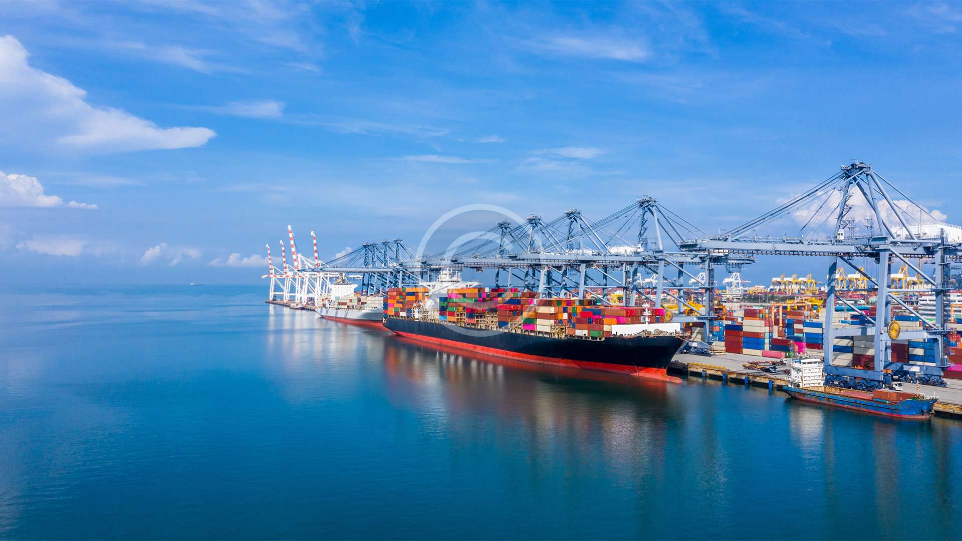 Container,Ship,At,Industrial,Port,In,Import,Export,Global,Business Container ship at industrial port in import export global business logistic and transportation, Container ship loading and unloading freight shipment, Aerial view container cargo boat freight ship.